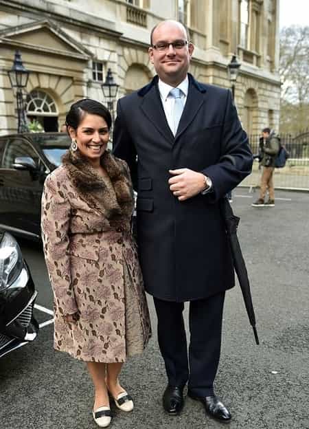 Priti Patel with her husband Alex Sawyer